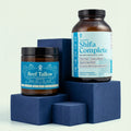Two Shifa Complete products on blue blocks with a white background
